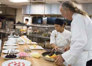 Chef instructing a student