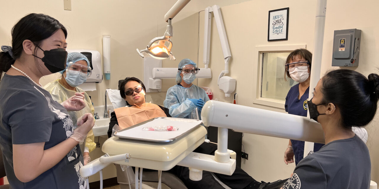Dental assisting students learn necessary terminology and applicable skills to provide highly discounted whitening services and free x-rays to community patients