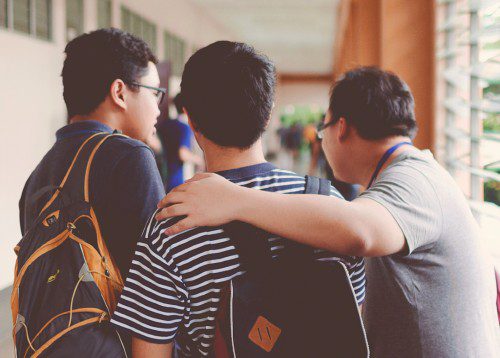 3 male High School students in the hall